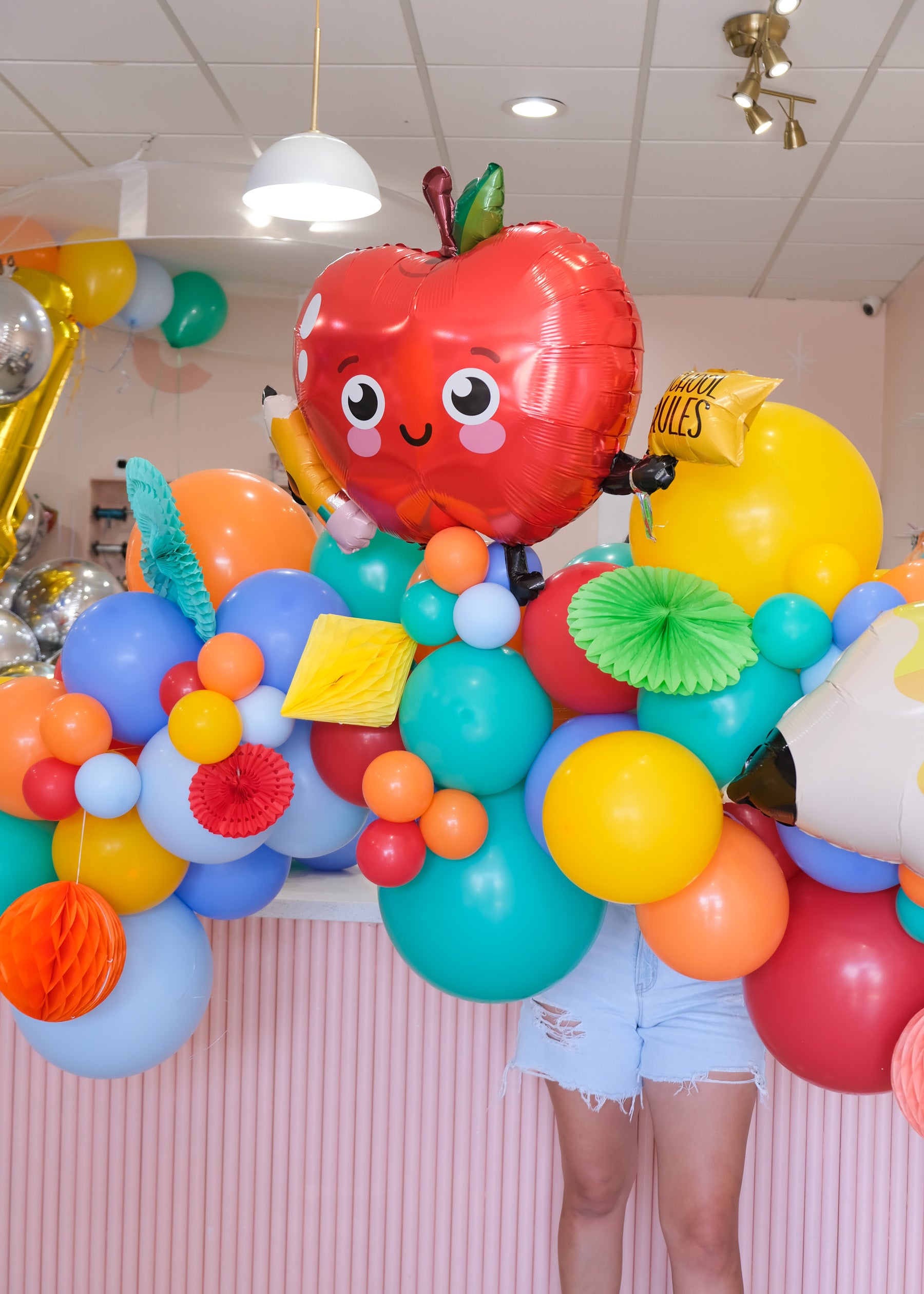 apple balloon on a colorful balloon garland