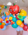 apple balloon on a colorful balloon garland
