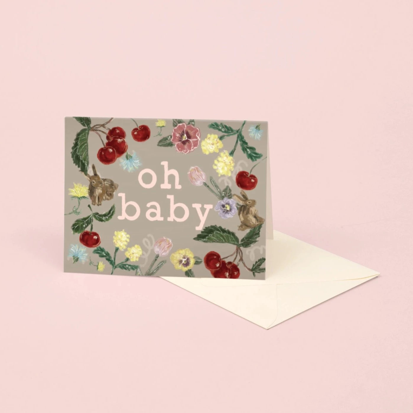 A baby greeting card with florals, fruit and bunnies
