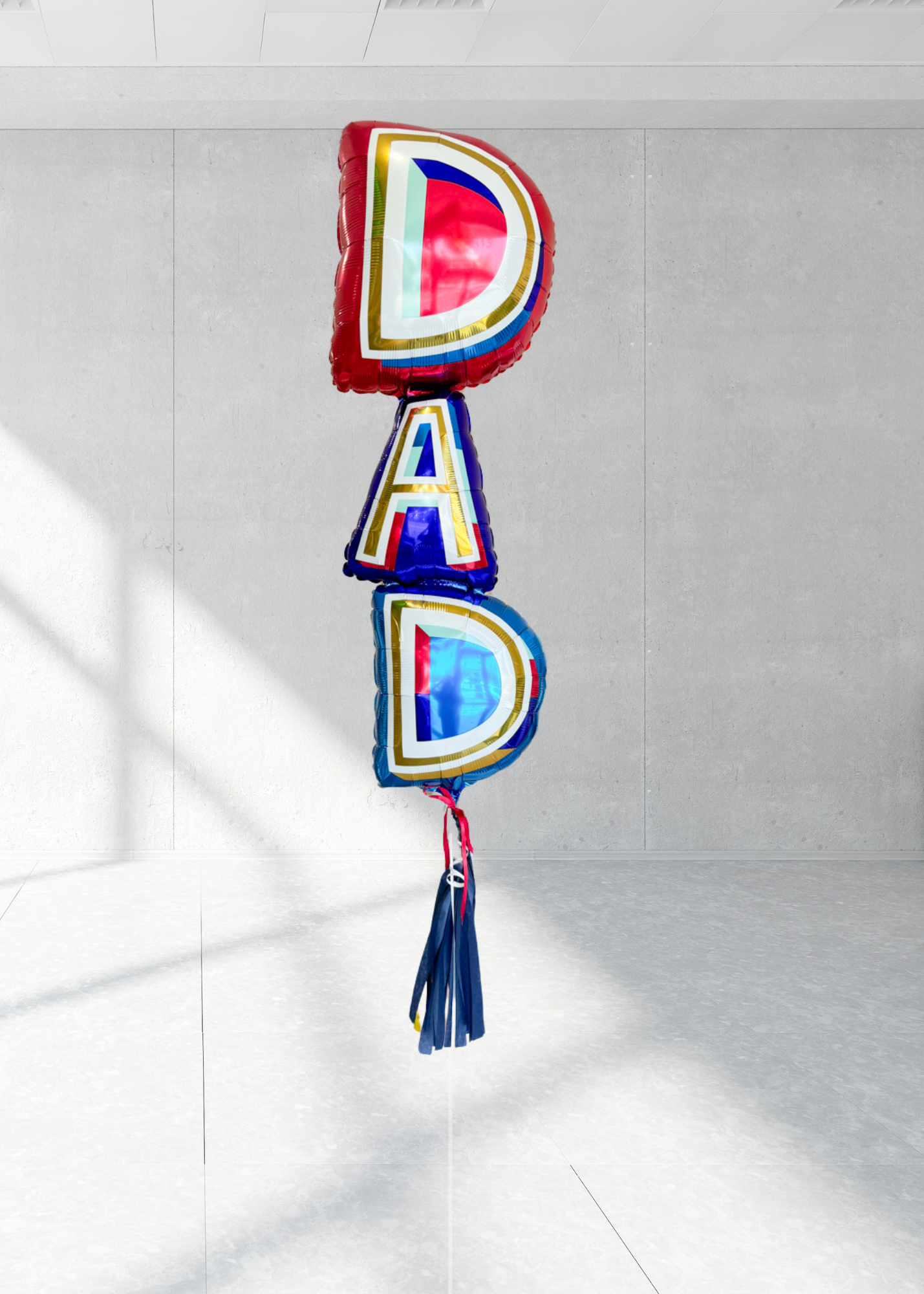 A bundle of Father's Day balloons with the word 'DAD' prominently displayed