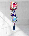 A bundle of Father's Day balloons with the word 'DAD' prominently displayed