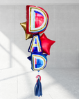 A bundle of Father's Day balloons with the word 'DAD' prominently displayed, featuring three stars behind it