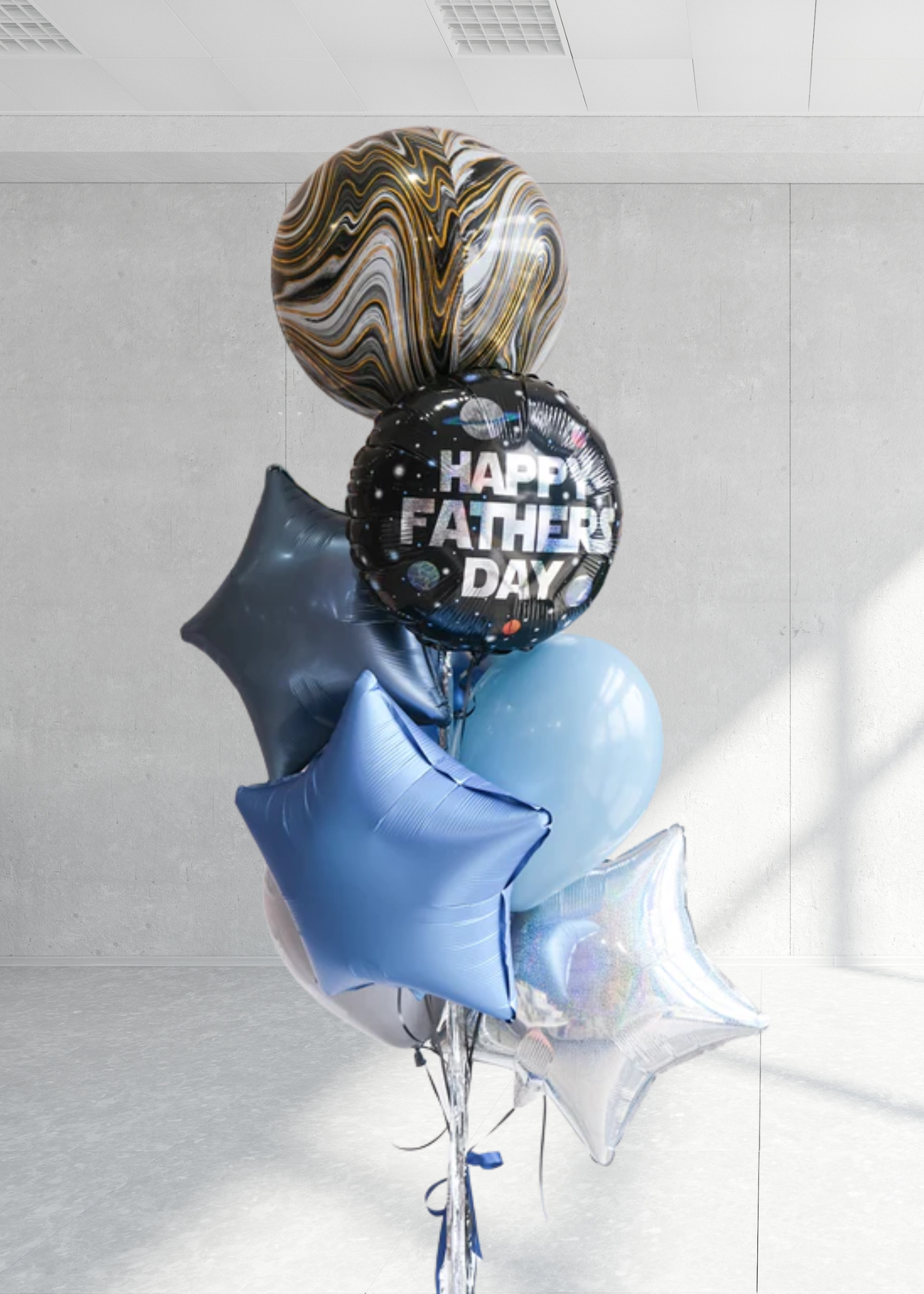 Balloon bouquet with 'Happy Father's Day' message on a light gray background