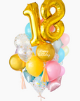 A balloon arrangement featuring a golden number '18' balloon with multicolored balloons tied to it, with the word 'Happy Birthday' printed on a gold balloon.