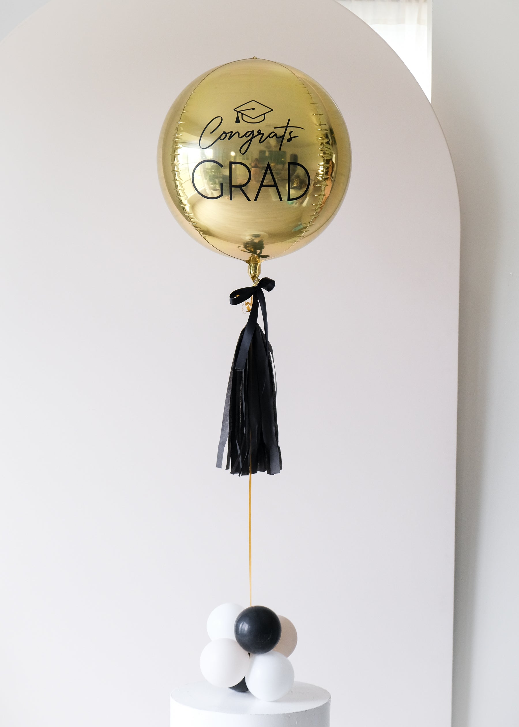 custom grad balloon with bow and tassel