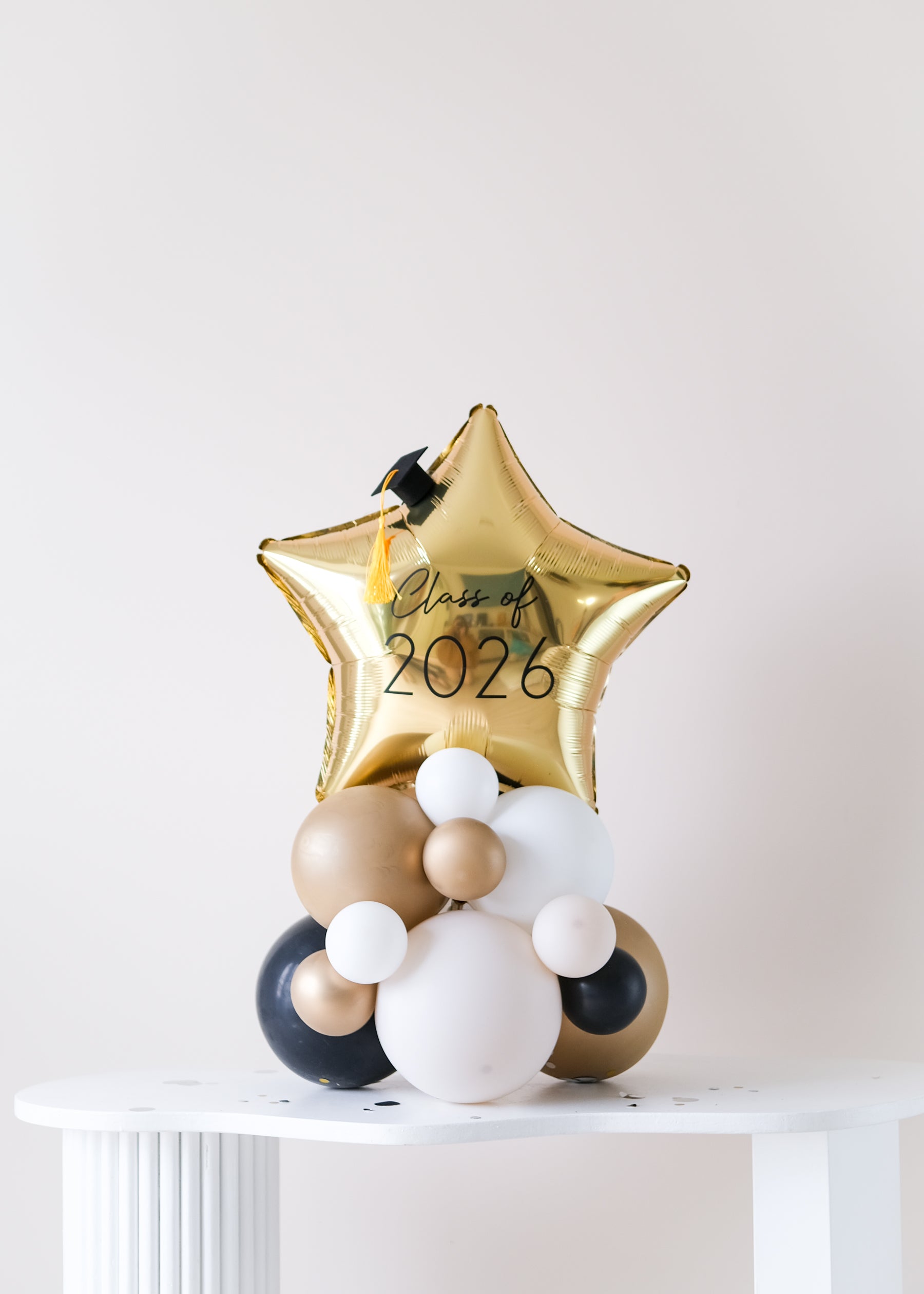 star balloon centerpiece with "class of 2026"