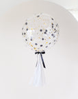 round confetti filled balloon with tassel