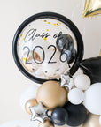 close up of clear balloon with mini balloons inside, featuring"Class of 2026" decal