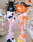 Halloween-themed balloon decorations in a store setting