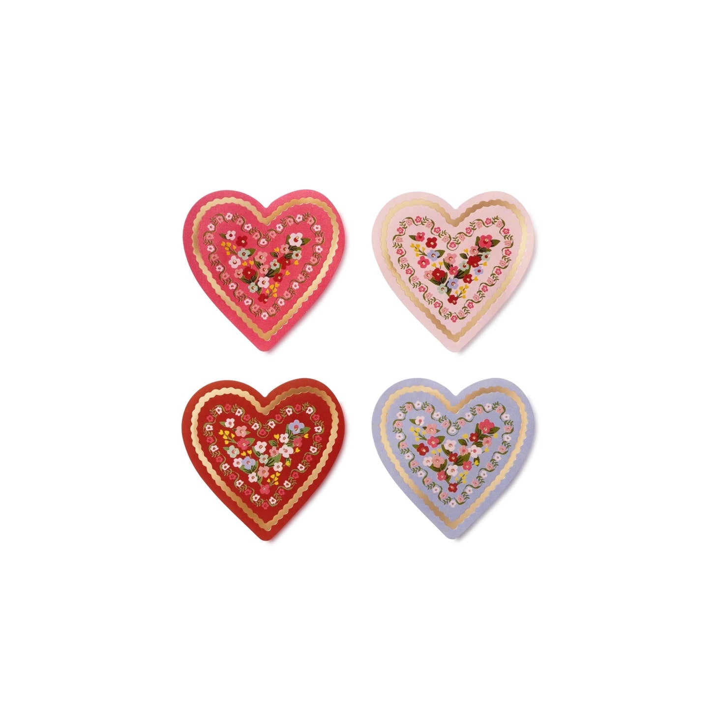 Four decorative heart-shaped items with floral patterns on a white background