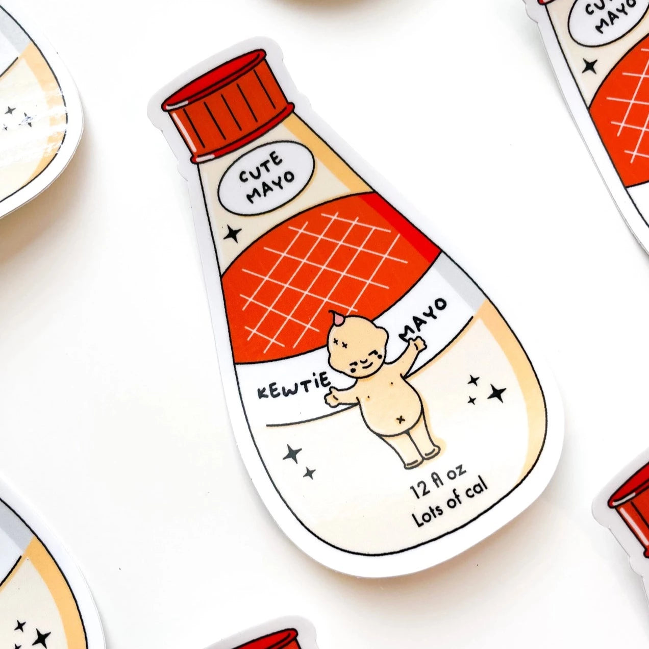 A collection of stickers with a cartoon illustration of a mayonnaise bottle and a cute animal, with the text 'Kewtie Mayo' and '12 oz (340g).'.