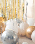 white gold cream silver balloons on the floor