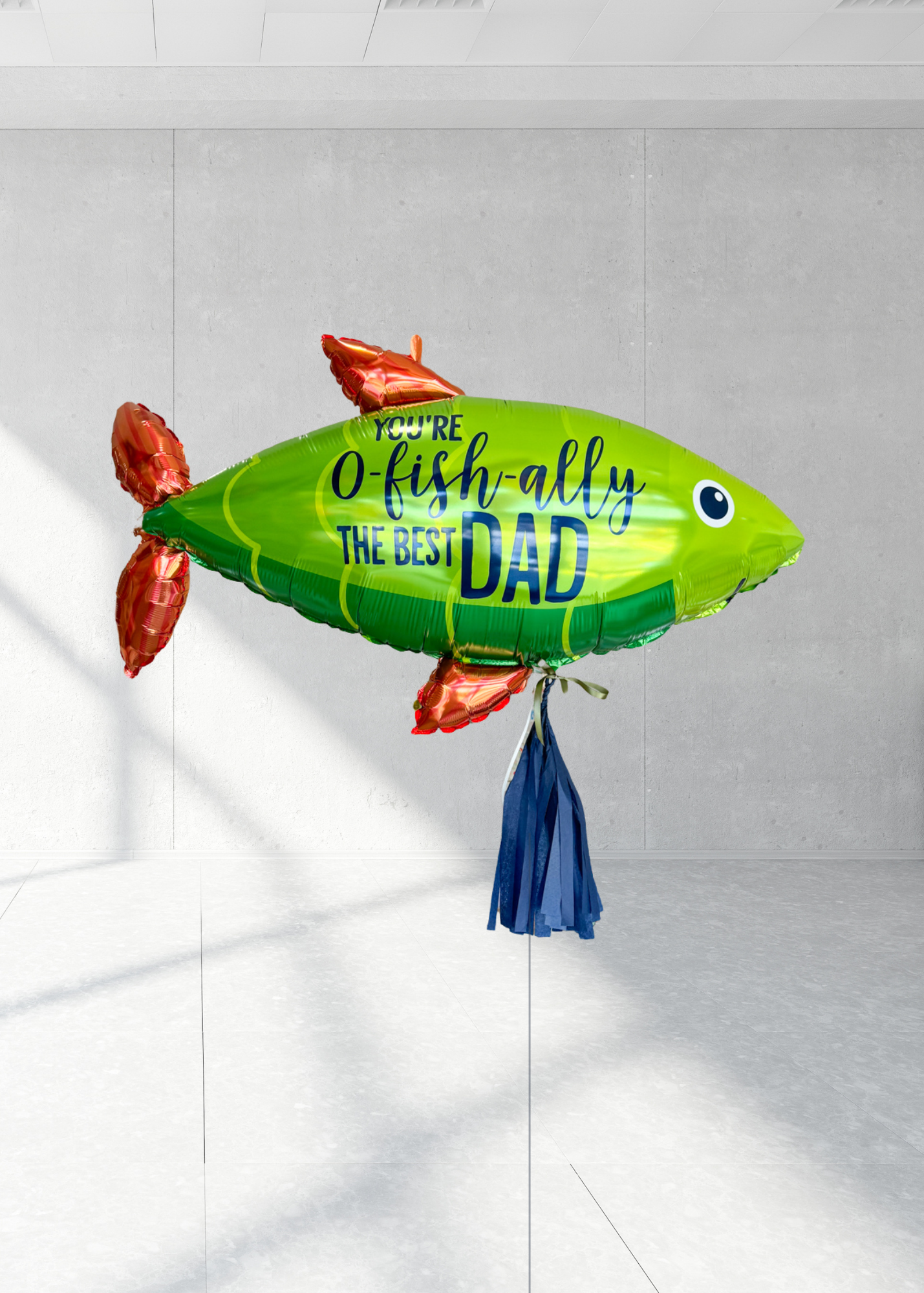 A large green fish with 'You-O-Fish-ally The Best Dad' printed on it.