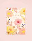 A floral printed notebook by clap clap in a pink background