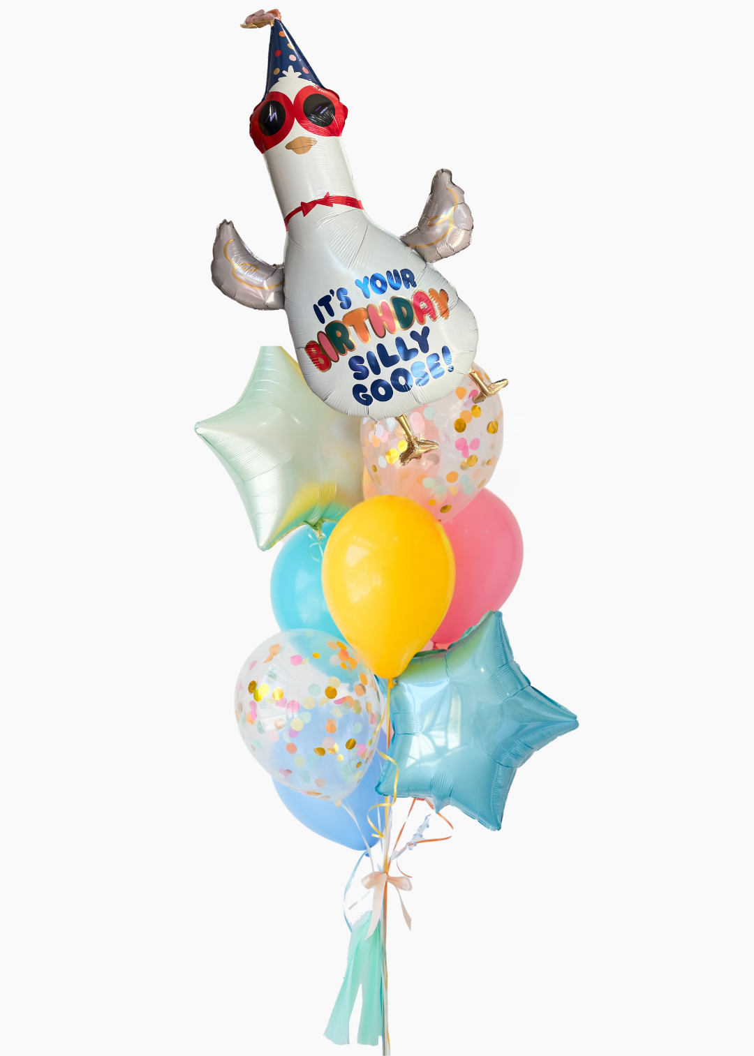 A birthday balloon bouquet featuring a white goose foil balloon with red sunglasses and the text 'IT'S YOUR BIRTHDAY SILLY GOOSE', surrounded by blue, pink, yellow, and clear confetti balloons on a white background.