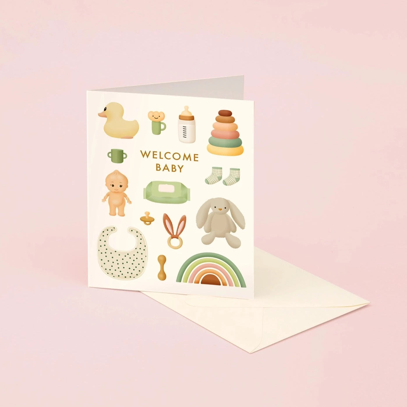 A greeting card with 'Welcome Baby' text and various pastel-colored illustrations of baby-related items such as a duck, a rattle, and a pair of baby shoes.