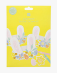 Packaging of Easter Bunny Crowns Kit with illustrations of bunny ears headbands and tissue paper flowers on a yellow background.