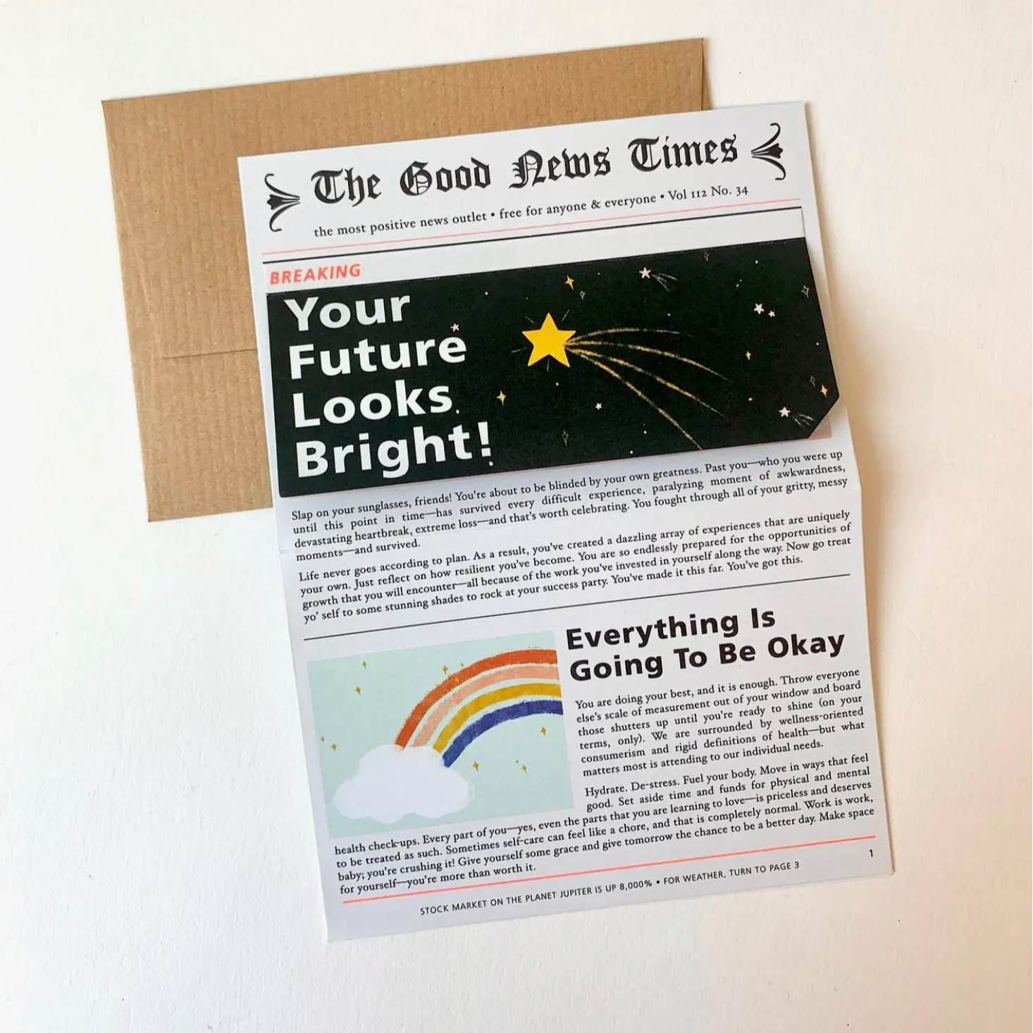 card that is opened to look like a news paper