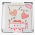 A clear box displaying a hand-glittered, heart-shaped sticker card with the words 'I love you' written on it, along with a blank card and a matching envelope.