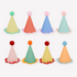 A collection of colorful party hats with crepe paper fringing and pompoms.
