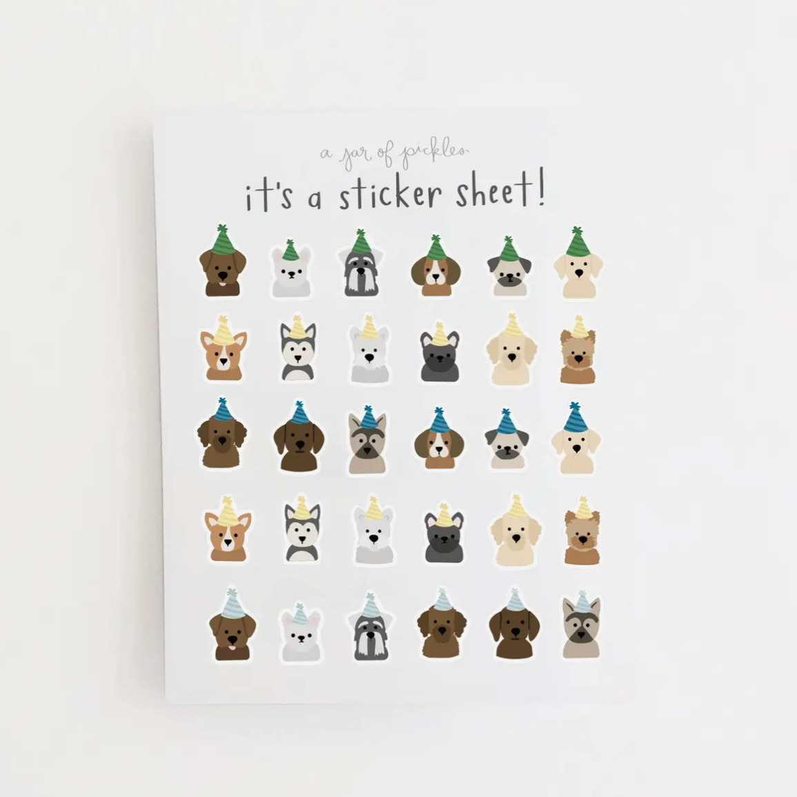 A clear sticker sheet with various cartoon dogs in different colors and poses.