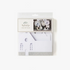 A package of Winter White 3D Tabletop Paper Houses with a Christmas theme, featuring a church and houses in a snowy setting.