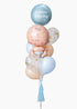 A baby balloon bouquet with a light skin baby and mixed blue latex and mylar balloons