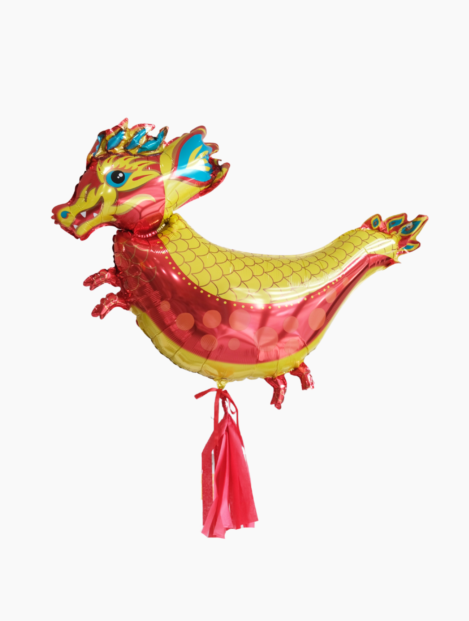A multicolored balloon designed to resemble a dragon, with red tassel details.