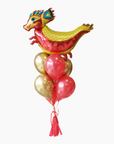 red dragon balloon with red and gold balloons underneath