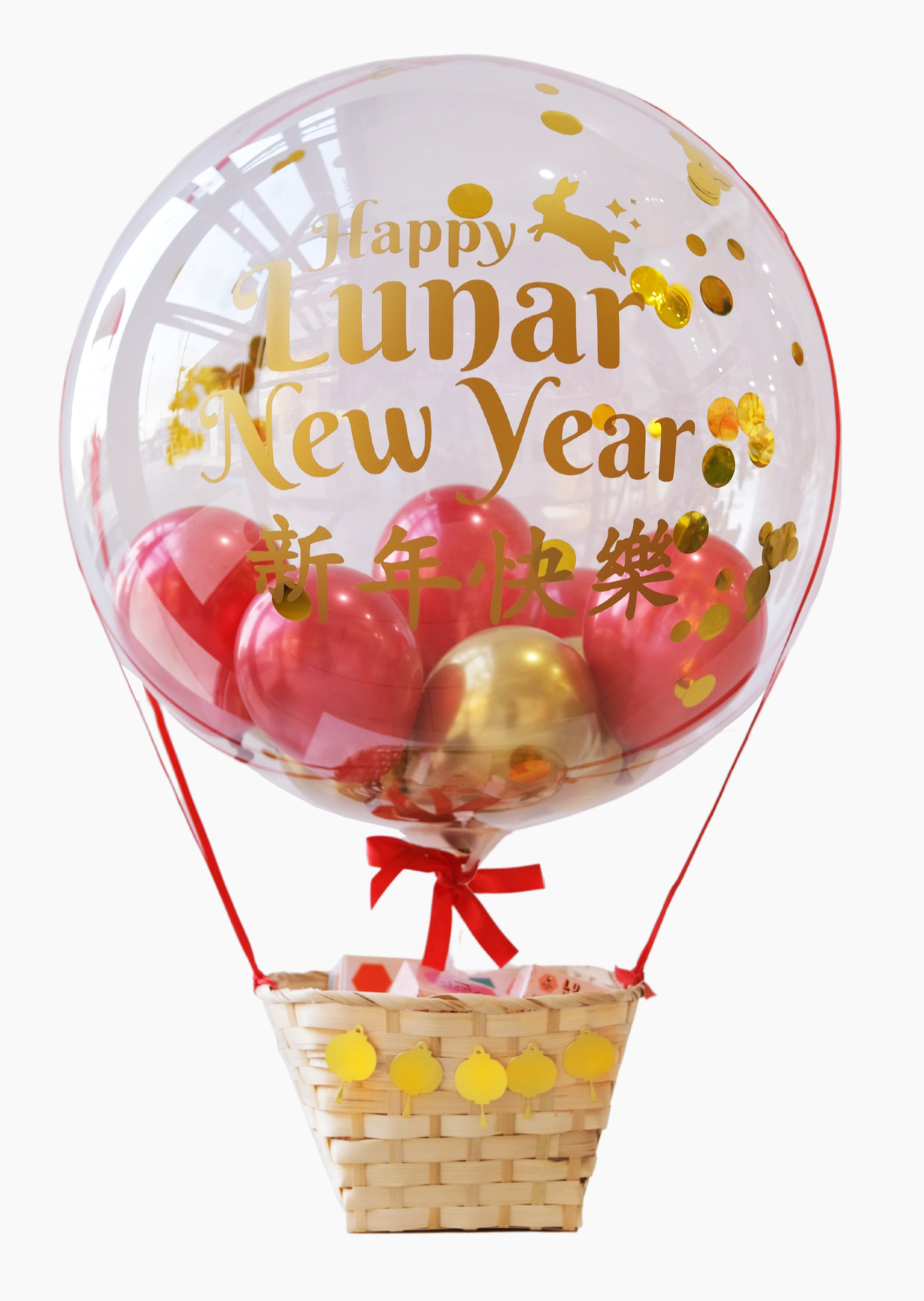 A clear hot air balloon with a Lunar New Year theme, featuring red and gold colors, with a basket containing fake fruit and a 'Happy Lunar New Year' message.